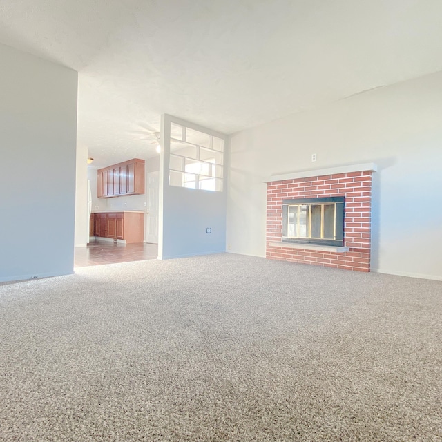 101 E 28th Ave, Bellevue, NE 68005 - unfurnished living room with carpet floors and a brick fireplace