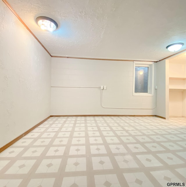 101 E 28th Ave, Bellevue, NE 68005 - unfurnished room with light flooring, a textured ceiling, baseboards, and ornamental molding
