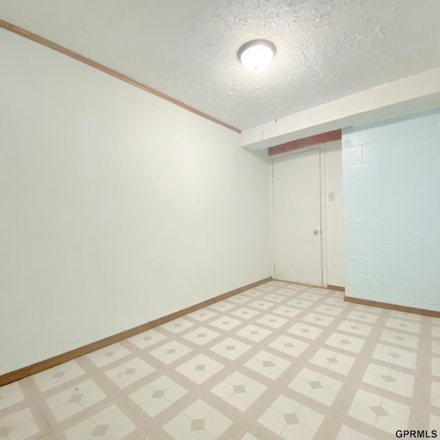 101 E 28th Ave, Bellevue, NE 68005 - empty room featuring light floors, a textured ceiling, and baseboards