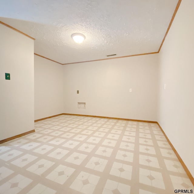 101 E 28th Ave, Bellevue, NE 68005 - empty room with ornamental molding, a textured ceiling, baseboards, and light flooring