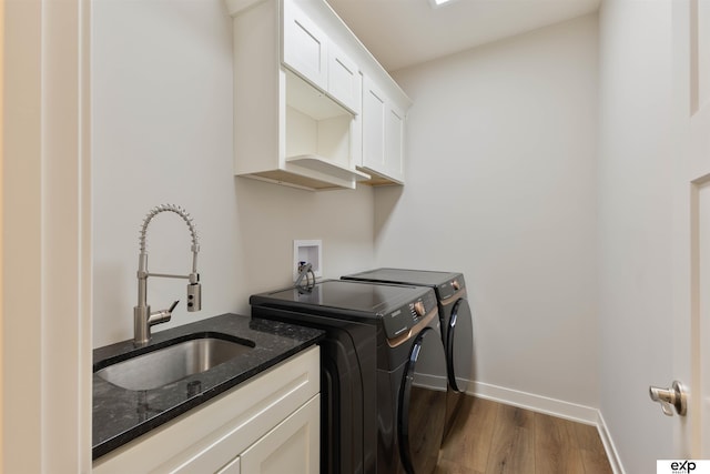 513 13th Ave, Plattsmouth, NE 68048 - washroom with separate washer and dryer, dark wood finished floors, cabinet space, and baseboards