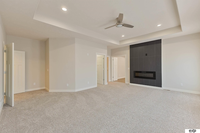 513 13th Ave, Plattsmouth, NE 68048 - unfurnished living room featuring a raised ceiling, a ceiling fan, baseboards, light carpet, and recessed lighting