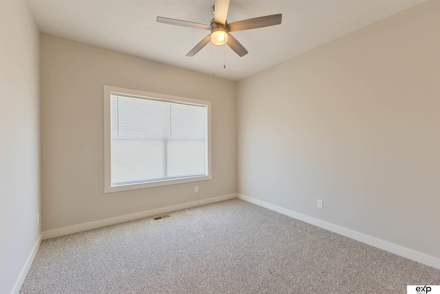 513 13th Ave, Plattsmouth, NE 68048 - unfurnished room with carpet floors, baseboards, and a ceiling fan