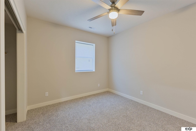 513 13th Ave, Plattsmouth, NE 68048 - unfurnished bedroom featuring carpet flooring, baseboards, and ceiling fan