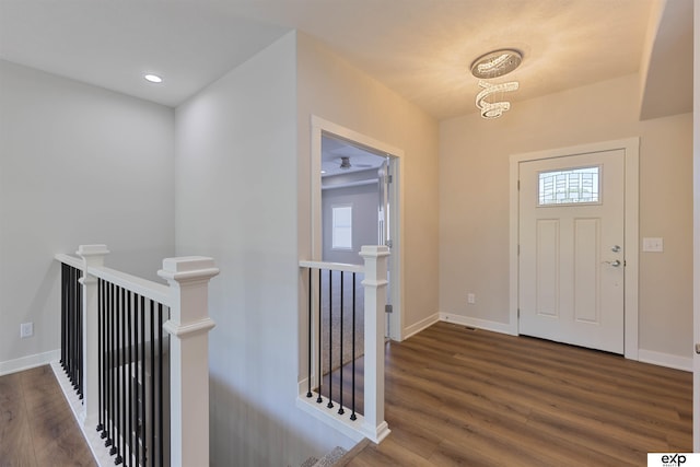 513 13th Ave, Plattsmouth, NE 68048 - entrance foyer with wood finished floors, baseboards, a chandelier, and recessed lighting
