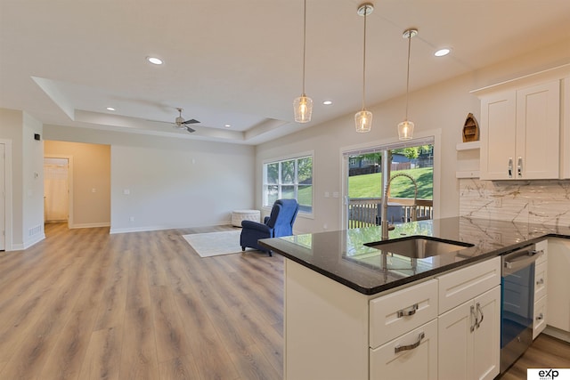 513 13th Ave, Plattsmouth, NE 68048 - kitchen featuring a sink, open shelves, a tray ceiling, white cabinetry, and recessed lighting