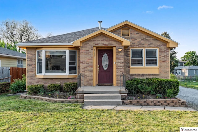 bungalow-style home with brick siding
