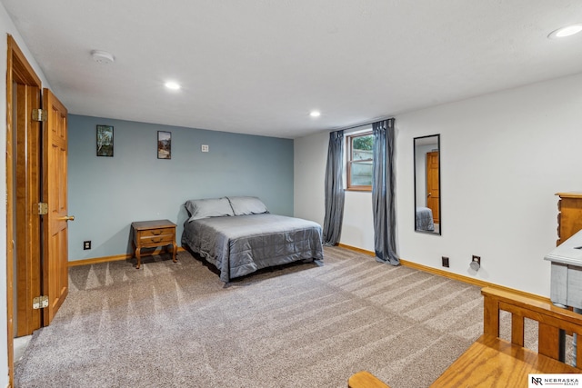 bedroom featuring light colored carpet, baseboards, and recessed lighting