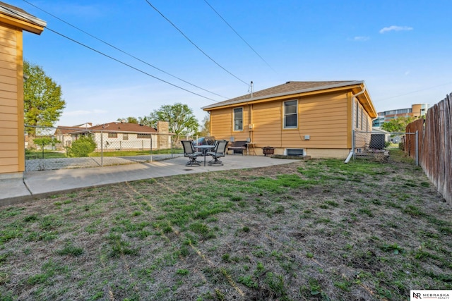 back of house featuring a patio area
