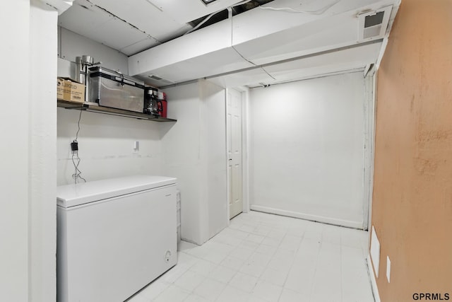 laundry area with washer and dryer and light floors