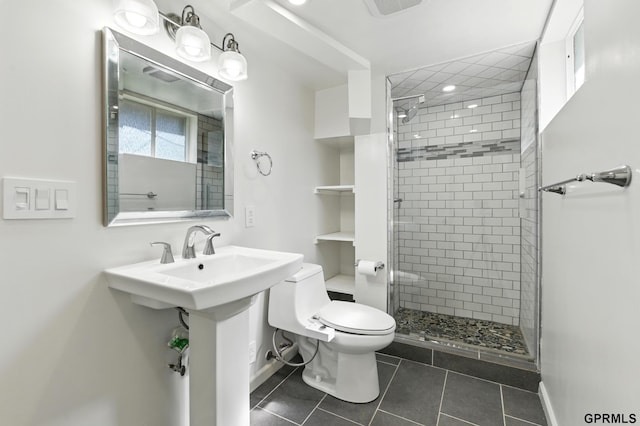 full bath featuring toilet, a stall shower, tile patterned flooring, and baseboards