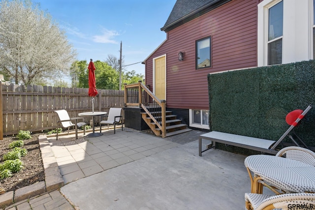 view of patio featuring fence