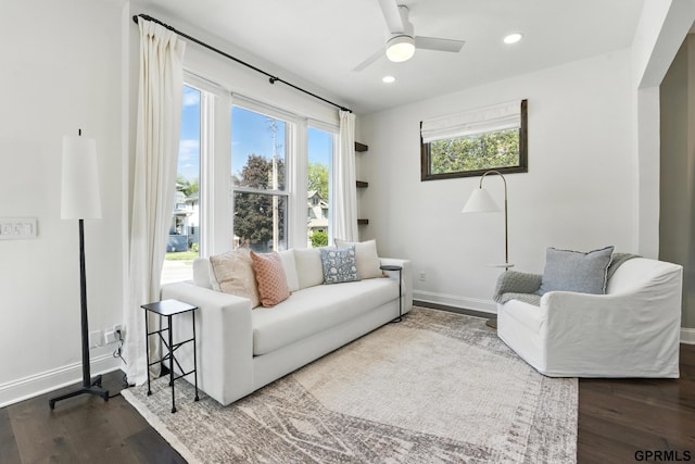 living room with baseboards, ceiling fan, wood finished floors, and recessed lighting