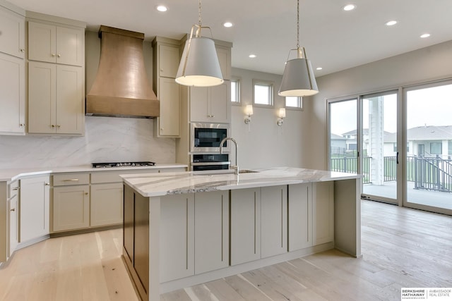 kitchen with custom range hood, stainless steel appliances, backsplash, recessed lighting, and light stone countertops