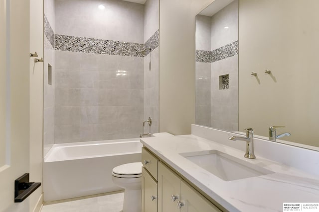 full bath featuring toilet, vanity, and shower / bathtub combination