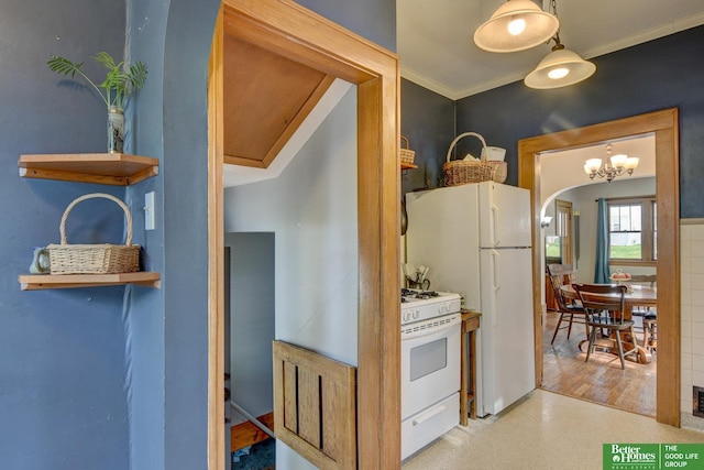 4939 Hickory St, Omaha, NE 68106 - kitchen with white range with gas stovetop, arched walkways, ornamental molding, and a chandelier