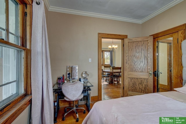 4939 Hickory St, Omaha, NE 68106 - bedroom with wood finished floors, a chandelier, and ornamental molding