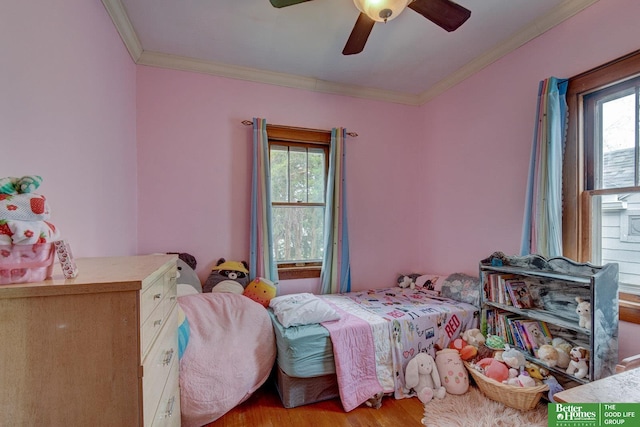 4939 Hickory St, Omaha, NE 68106 - bedroom with multiple windows, crown molding, light wood-type flooring, and ceiling fan