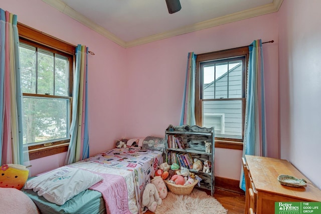 4939 Hickory St, Omaha, NE 68106 - bedroom featuring multiple windows, wood finished floors, ornamental molding, and a ceiling fan