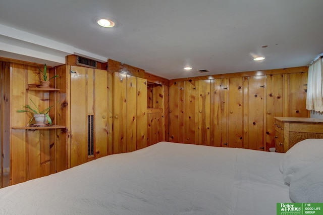 4939 Hickory St, Omaha, NE 68106 - bedroom featuring wood walls and recessed lighting