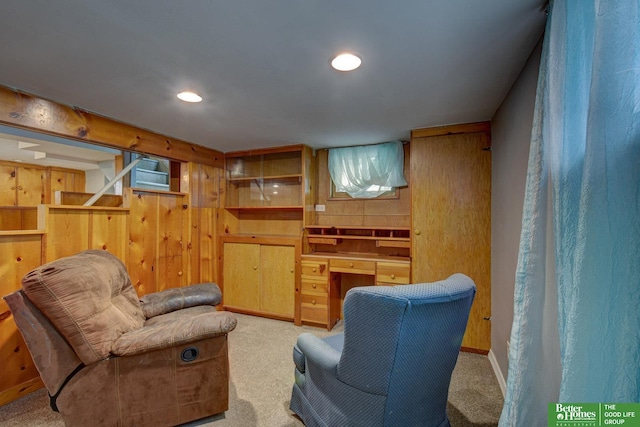 4939 Hickory St, Omaha, NE 68106 - living area with carpet, wooden walls, and recessed lighting