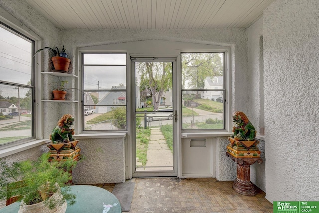 4939 Hickory St, Omaha, NE 68106 - sunroom featuring plenty of natural light and a textured wall