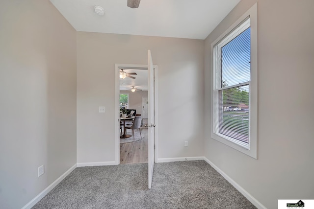 927 Garfield St, Lincoln, NE 68502 - unfurnished room with ceiling fan, carpet flooring, a desk, and baseboards