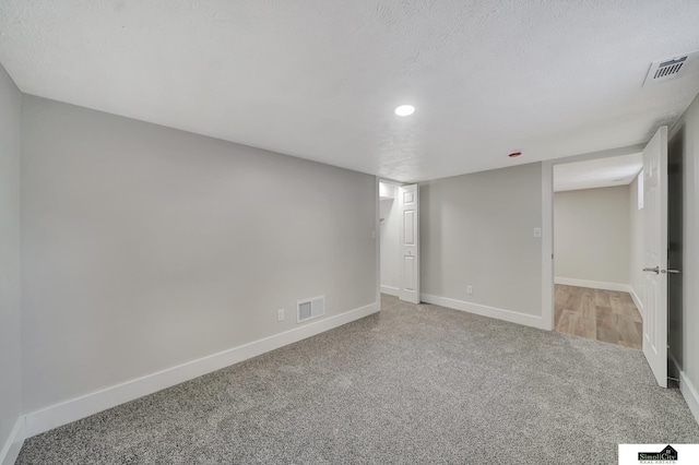 927 Garfield St, Lincoln, NE 68502 - finished basement featuring carpet flooring, baseboards, recessed lighting, and a textured ceiling