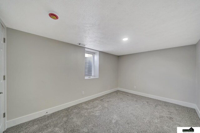 927 Garfield St, Lincoln, NE 68502 - carpeted empty room with baseboards and recessed lighting