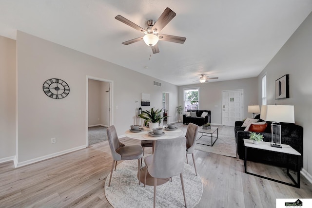 927 Garfield St, Lincoln, NE 68502 - dining area with ceiling fan, light wood-style flooring, and baseboards