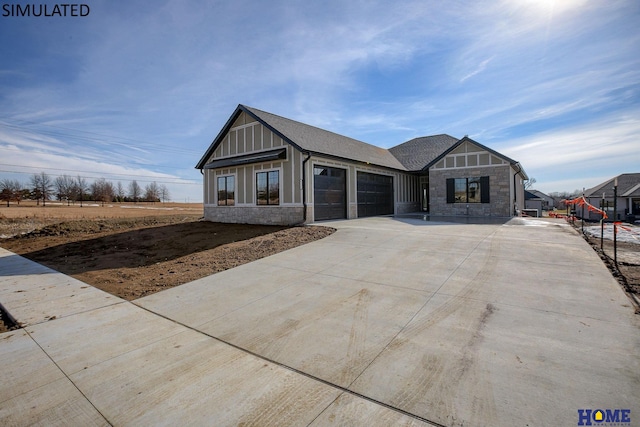 view of front of home with a garage, stone siding, concrete driveway, and roof with shingles