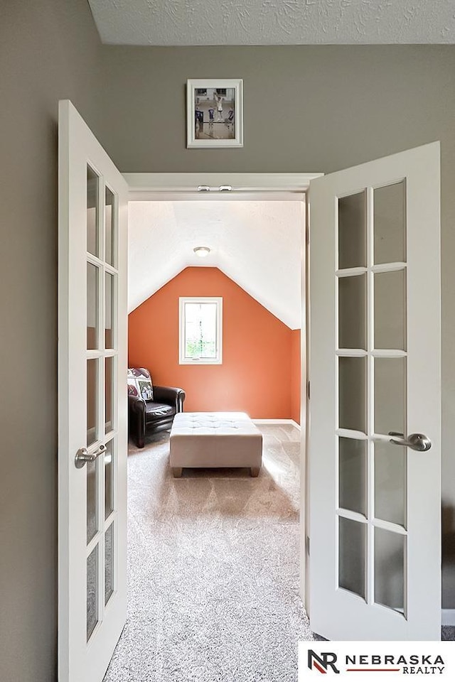 bedroom featuring vaulted ceiling and carpet flooring