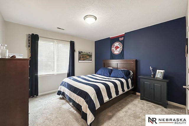 carpeted bedroom featuring baseboards