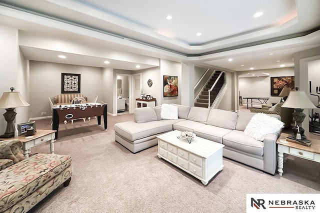living area with light carpet, recessed lighting, and stairs