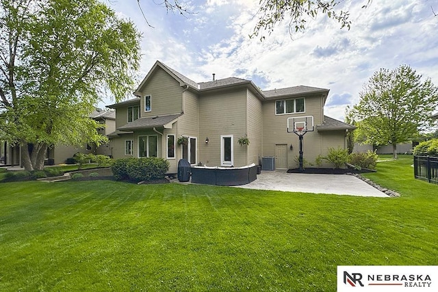 back of property featuring a patio and central AC