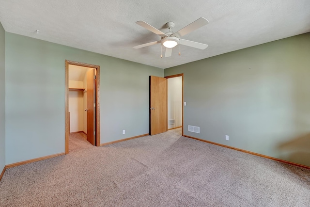 4630 Eagle Ridge Rd, Lincoln, NE 68516 - unfurnished bedroom featuring baseboards, light colored carpet, and a walk in closet