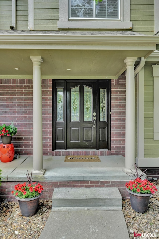 4630 Eagle Ridge Rd, Lincoln, NE 68516 - view of exterior entry featuring a porch and brick siding