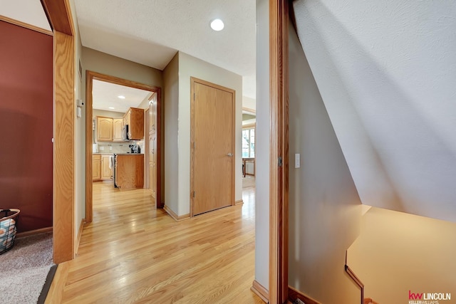 4630 Eagle Ridge Rd, Lincoln, NE 68516 - corridor with light wood-type flooring, baseboards, and recessed lighting