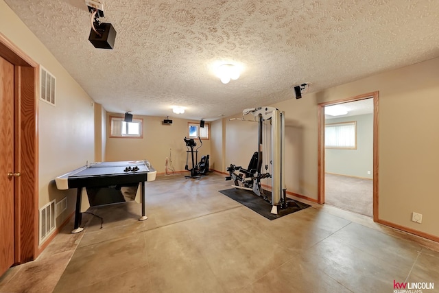 4630 Eagle Ridge Rd, Lincoln, NE 68516 - exercise area featuring baseboards and a textured ceiling