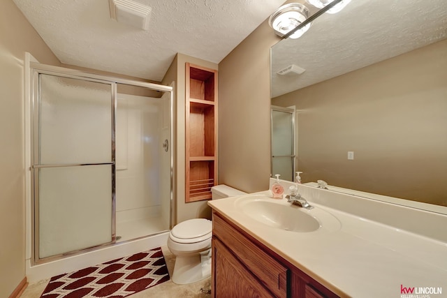 4630 Eagle Ridge Rd, Lincoln, NE 68516 - bathroom featuring a shower stall, a textured ceiling, toilet, and vanity