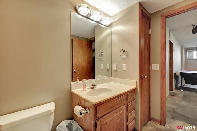4630 Eagle Ridge Rd, Lincoln, NE 68516 - bathroom with a textured ceiling, toilet, and vanity