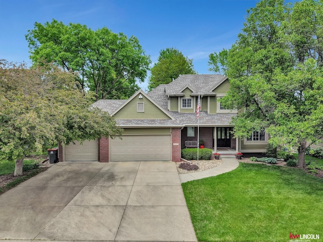 4630 Eagle Ridge Rd, Lincoln, NE 68516 - view of front facade featuring concrete driveway, a front yard, an attached garage, roof with shingles, and brick siding