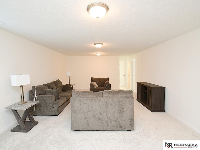 living room with carpet floors and baseboards