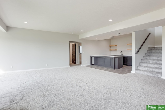 5705 N 197th St, Elkhorn, NE 68022 - unfurnished living room featuring recessed lighting, light colored carpet, and stairs