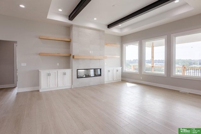 5705 N 197th St, Elkhorn, NE 68022 - unfurnished living room with healthy amount of natural light, light wood-style flooring, beamed ceiling, and recessed lighting