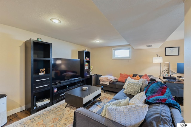 1909 Collins Dr, Bellevue, NE 68005 - living room featuring wood finished floors, baseboards, and recessed lighting