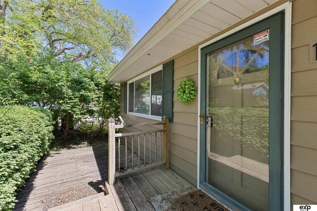 1909 Collins Dr, Bellevue, NE 68005 - doorway to property featuring a wooden deck