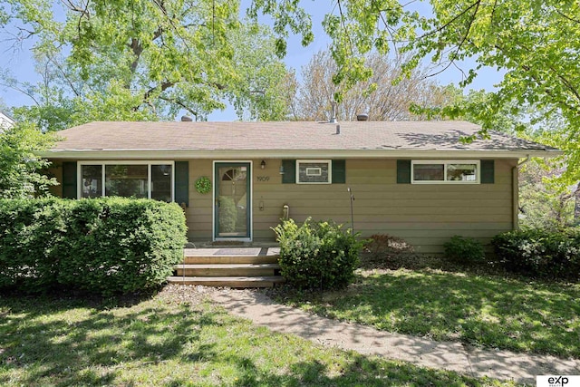 1909 Collins Dr, Bellevue, NE 68005 - ranch-style house with a front yard and a shingled roof