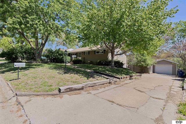 1909 Collins Dr, Bellevue, NE 68005 - view of front of home featuring an outdoor structure, a detached garage, and driveway