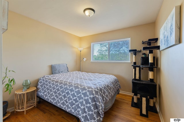 1909 Collins Dr, Bellevue, NE 68005 - bedroom featuring wood finished floors and baseboards